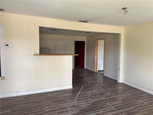 423 S 13th St, Kingsville, TX 78363 - empty room with wood finished floors and baseboards