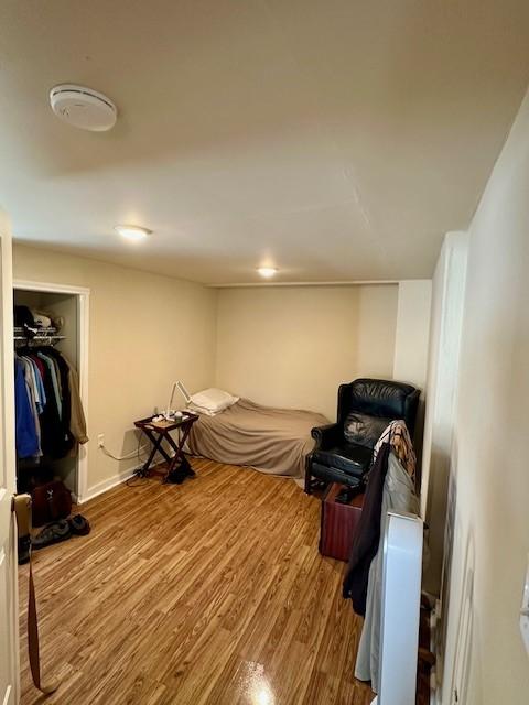 bedroom with hardwood / wood-style floors