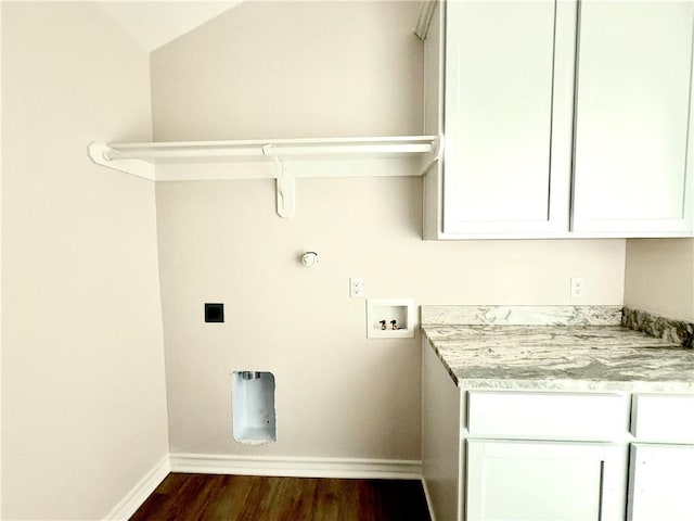 clothes washing area featuring washer hookup, baseboards, cabinet space, dark wood-style floors, and electric dryer hookup