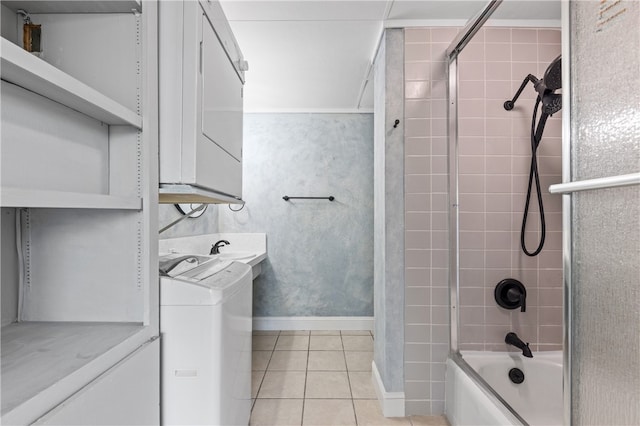 bathroom with vanity, bath / shower combo with glass door, tile patterned flooring, and washer / dryer