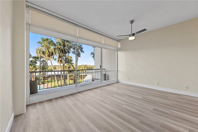 empty room featuring light hardwood / wood-style floors and ceiling fan