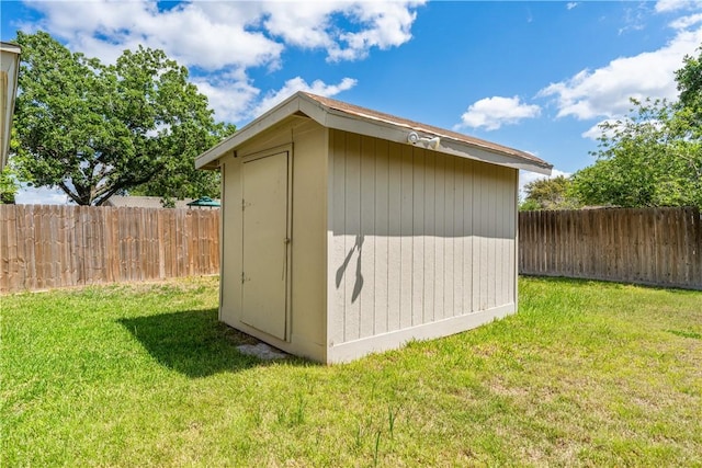 view of shed featuring a fenced backyard