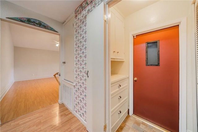 hall with light wood-style floors