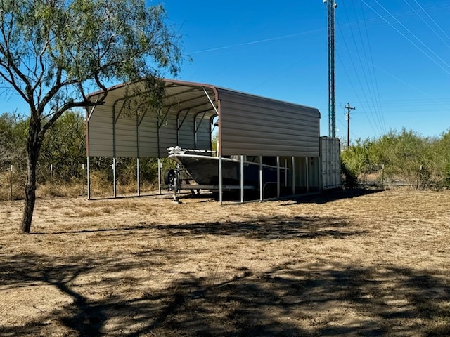 view of vehicle parking featuring a carport