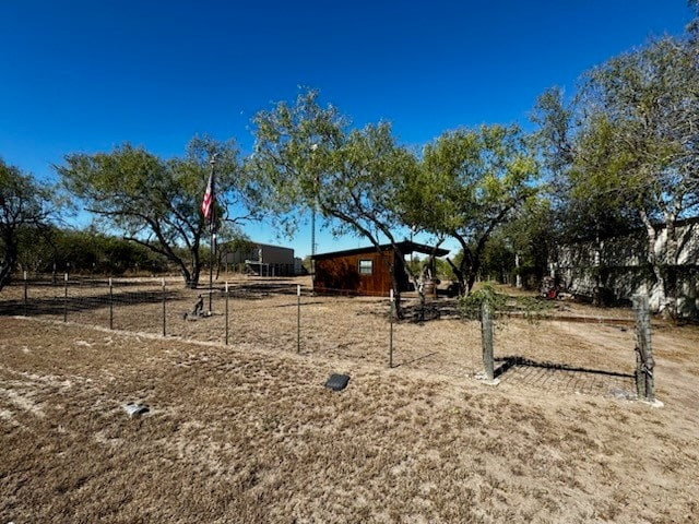 view of jungle gym with a rural view