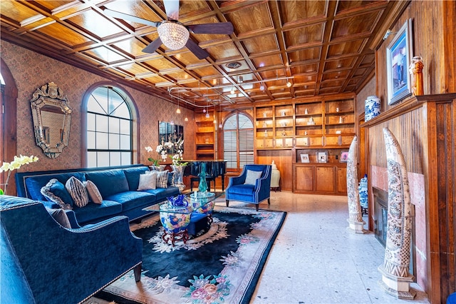 living room with wood ceiling, ceiling fan, and coffered ceiling