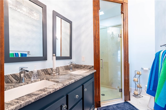 bathroom with a shower with door and vanity