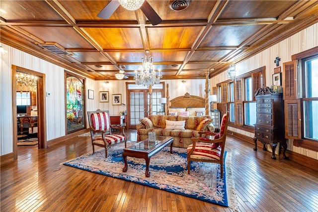 121 Glenmore St, Corpus Christi, TX 78412 - living area with wood ceiling, a chandelier, hardwood / wood-style flooring, wood walls, and a ceiling fan