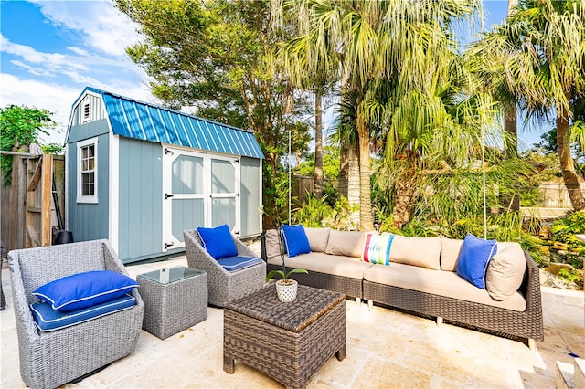 view of patio with a storage unit and outdoor lounge area