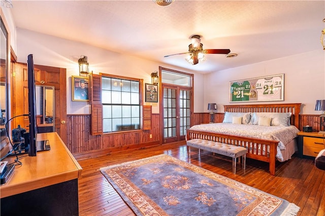 121 Glenmore St, Corpus Christi, TX 78412 - bedroom featuring hardwood / wood-style floors, a wainscoted wall, and wood walls