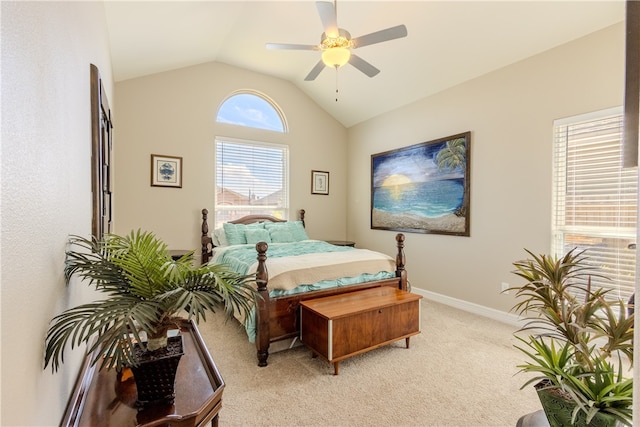 bedroom featuring lofted ceiling, light colored carpet, and ceiling fan