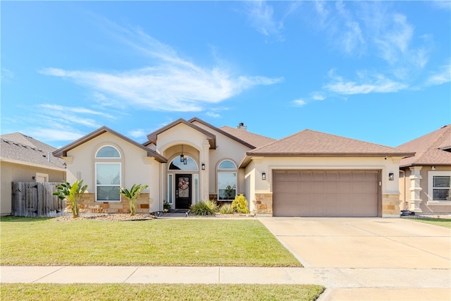 view of front of home featuring a garage and a front lawn