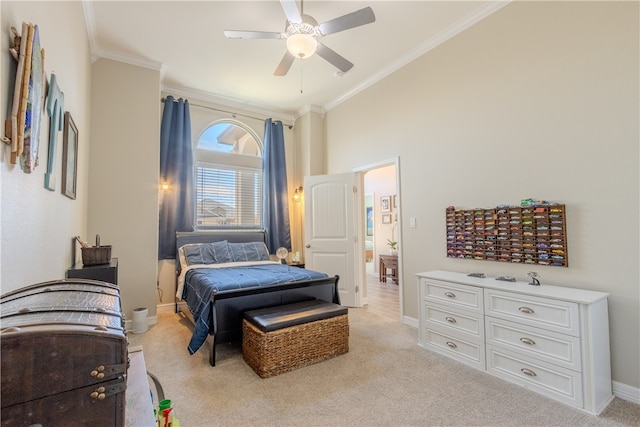 bedroom featuring ceiling fan, light colored carpet, and ornamental molding