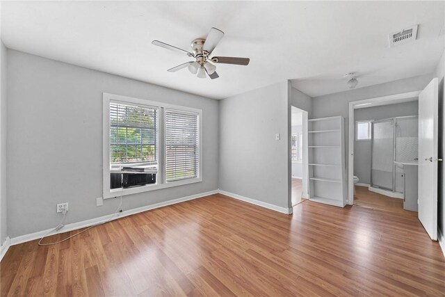 empty room featuring ceiling fan and hardwood / wood-style flooring