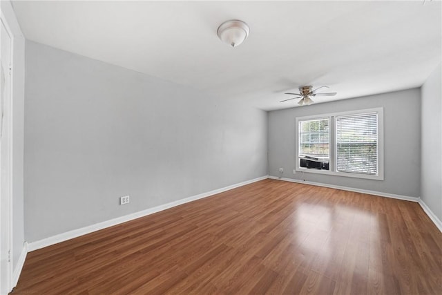 spare room featuring ceiling fan and hardwood / wood-style flooring