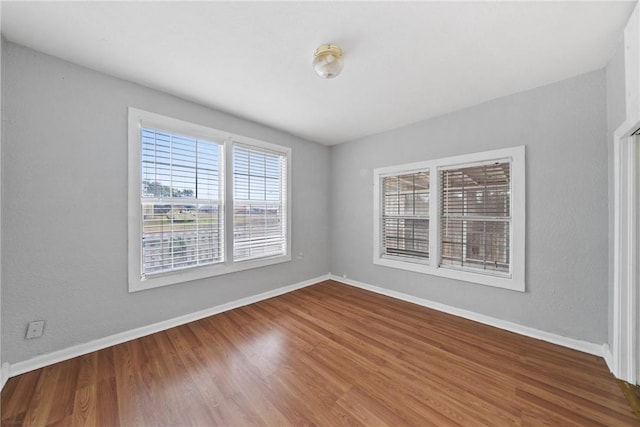 empty room featuring hardwood / wood-style flooring