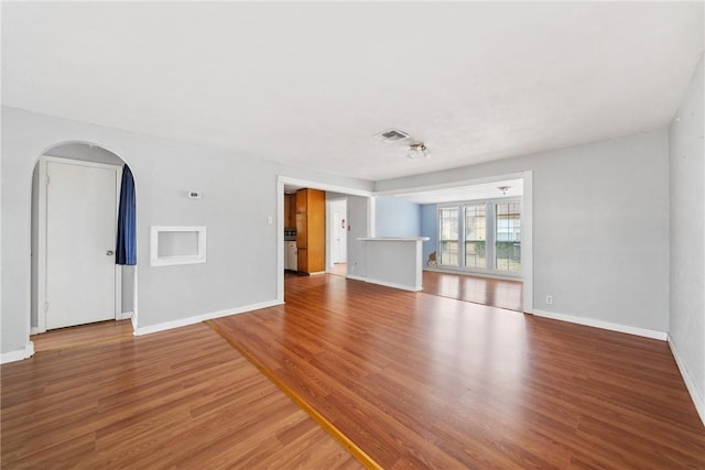 unfurnished living room with hardwood / wood-style floors