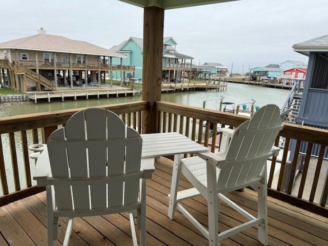 wooden deck with a water view