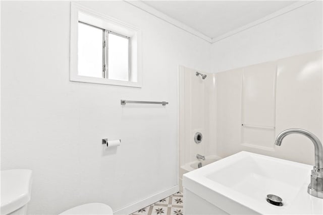 full bath featuring a sink, toilet, tile patterned floors, baseboards, and shower / washtub combination
