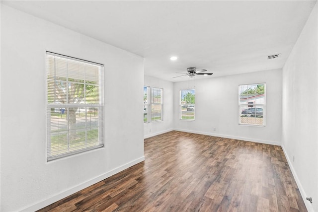 unfurnished room featuring visible vents, baseboards, dark wood-type flooring, recessed lighting, and a ceiling fan