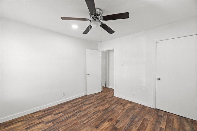 unfurnished bedroom with baseboards and wood finished floors
