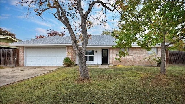 ranch-style house with a front yard and a garage