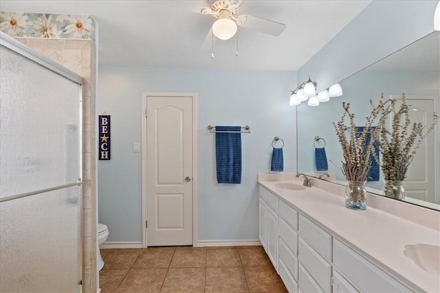 15230 Isla Pinta Ct, Corpus Christi, TX 78418 - bathroom featuring double vanity, a stall shower, tile patterned floors, and a ceiling fan
