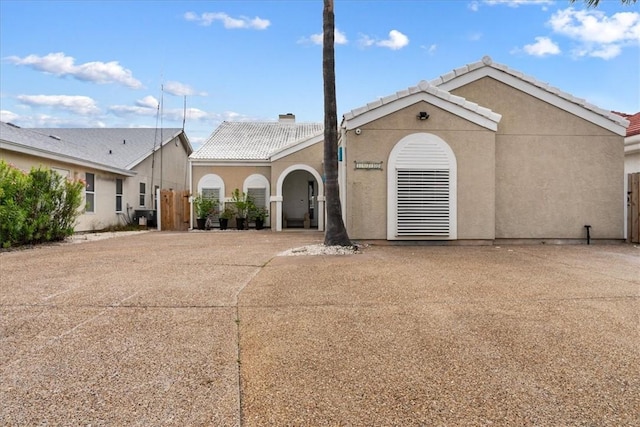 15230 Isla Pinta Ct, Corpus Christi, TX 78418 - mediterranean / spanish-style home with a tile roof, stucco siding, and a gate