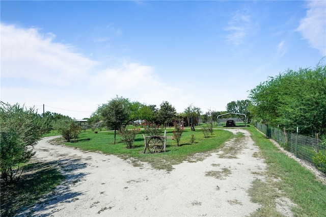 view of home's community with a yard