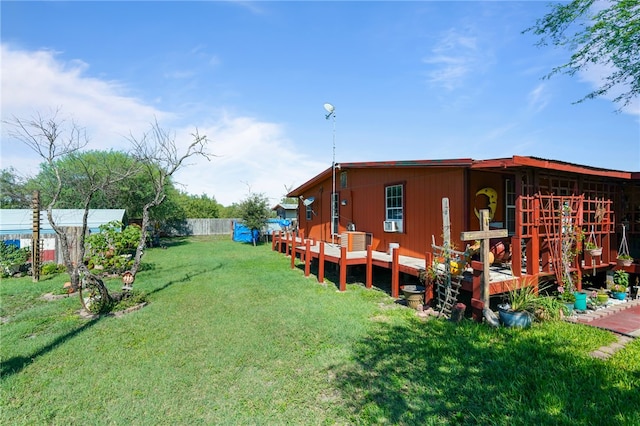 view of yard featuring a wooden deck