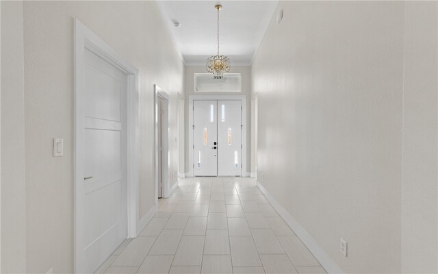 interior space with ornamental molding and a towering ceiling