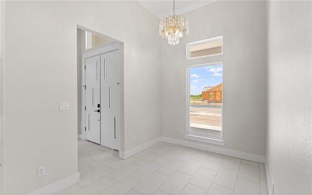 kitchen with hanging light fixtures, a kitchen bar, crown molding, and white cabinets