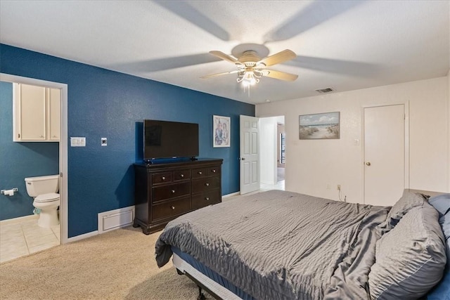 bedroom featuring carpet, baseboards, visible vents, ceiling fan, and connected bathroom