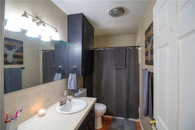 1512 Palo Blanco, Beeville, TX 78102 - bathroom with tasteful backsplash, toilet, a shower with curtain, and vanity