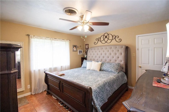 1512 Palo Blanco, Beeville, TX 78102 - bedroom featuring light tile patterned floors, visible vents, a ceiling fan, and baseboards