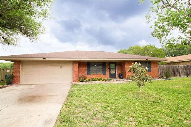 1512 Palo Blanco, Beeville, TX 78102 - ranch-style home featuring fence, brick siding, and a garage