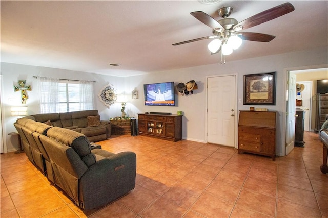1512 Palo Blanco, Beeville, TX 78102 - living area with light tile patterned floors and ceiling fan