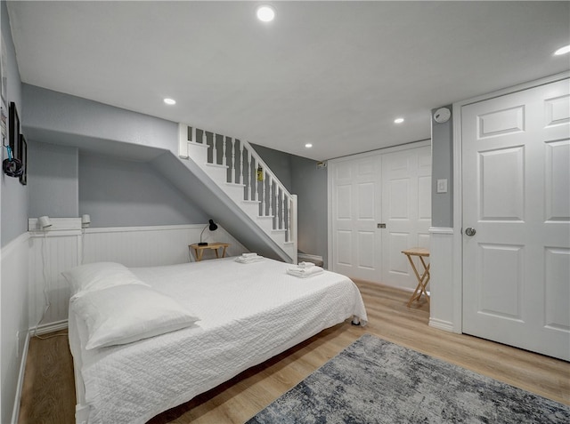 bedroom featuring a closet and light wood-type flooring