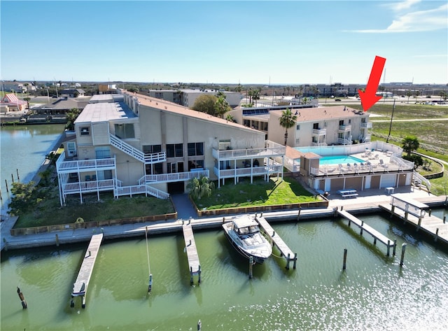 birds eye view of property featuring a water view