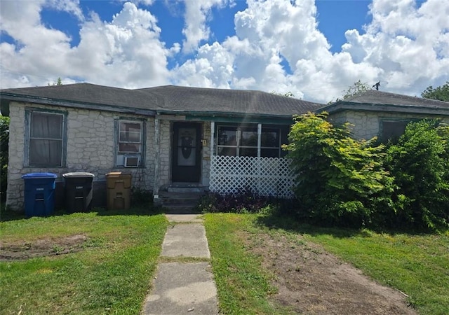 3751 Wilson Dr, Corpus Christi, TX 78408 - view of front of property featuring stone siding and a front lawn