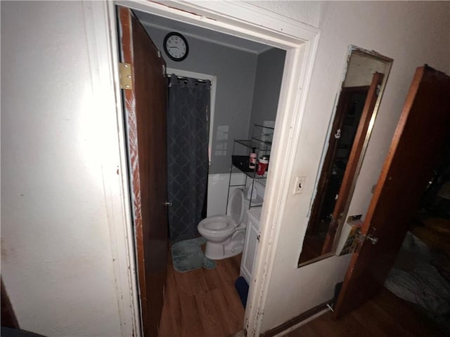 3751 Wilson Dr, Corpus Christi, TX 78408 - bathroom with wood finished floors and a shower with shower curtain