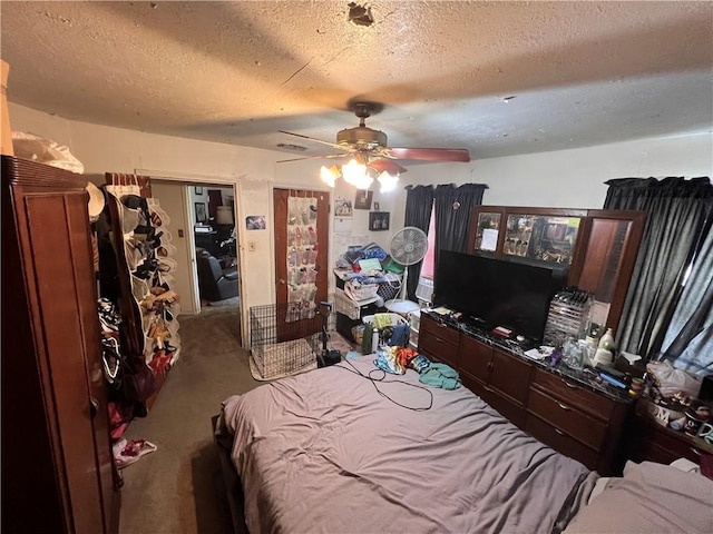 3751 Wilson Dr, Corpus Christi, TX 78408 - carpeted bedroom featuring a textured ceiling and a ceiling fan