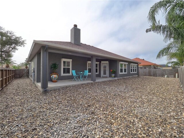 rear view of house with a patio area