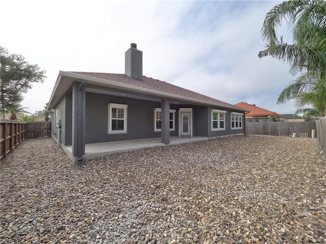 rear view of house with a patio