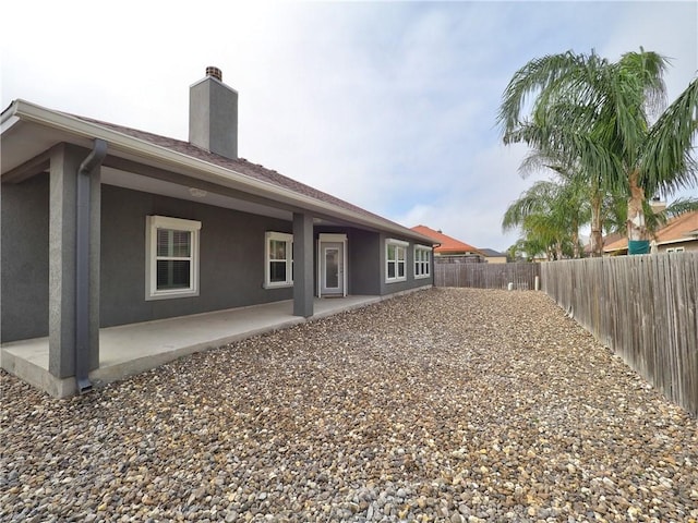 rear view of property with a patio area