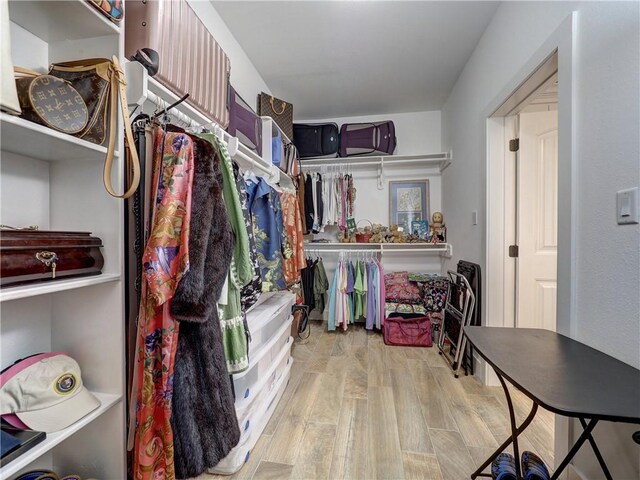 spacious closet featuring light wood-type flooring