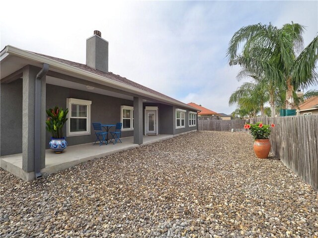 back of property featuring a patio