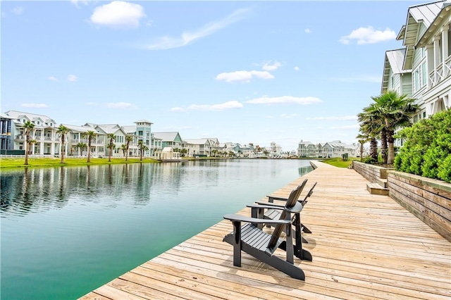 dock area with a water view and a residential view