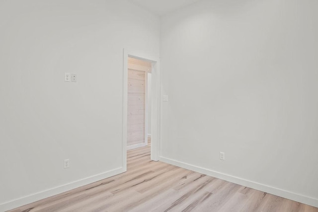 spare room with light hardwood / wood-style floors