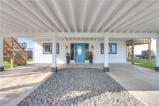 doorway to property with a carport